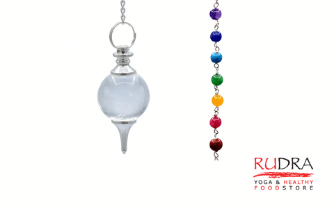 Pendulum from rock crystal in a chain of chakra colors